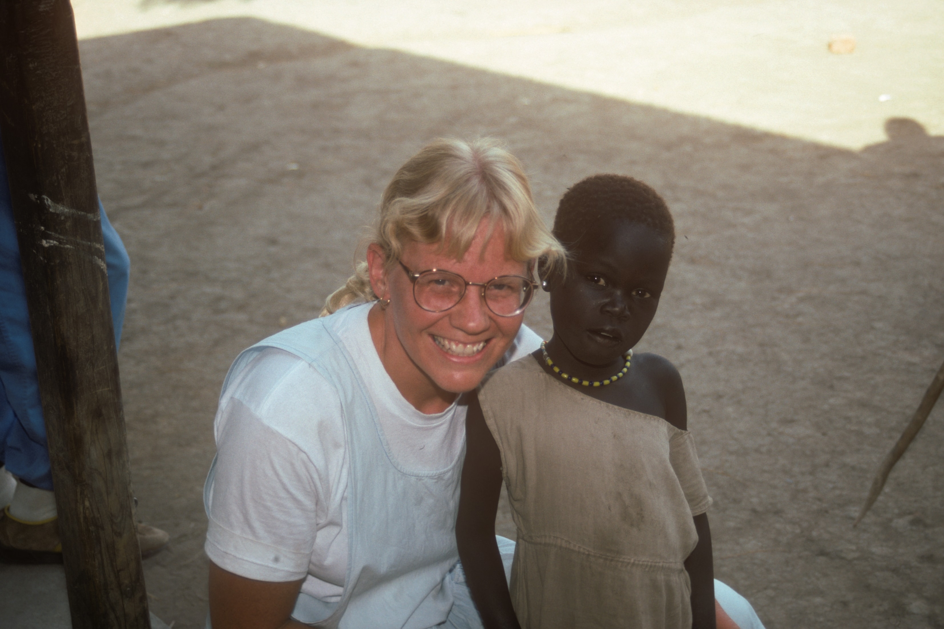 Susan with a child in Sudan